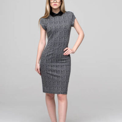 Blonde young smart caucasian businesswoman posing full body